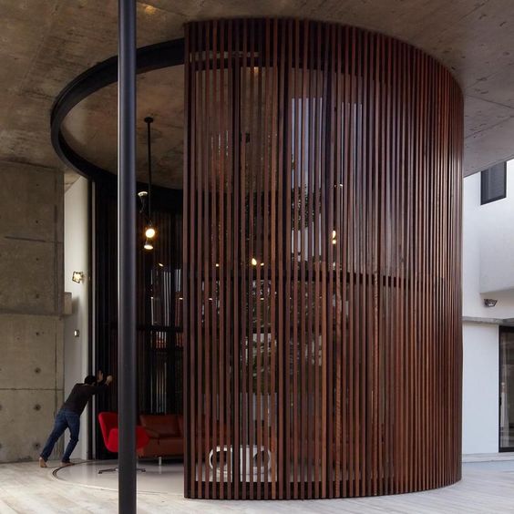 A wall of wooden slats on a track