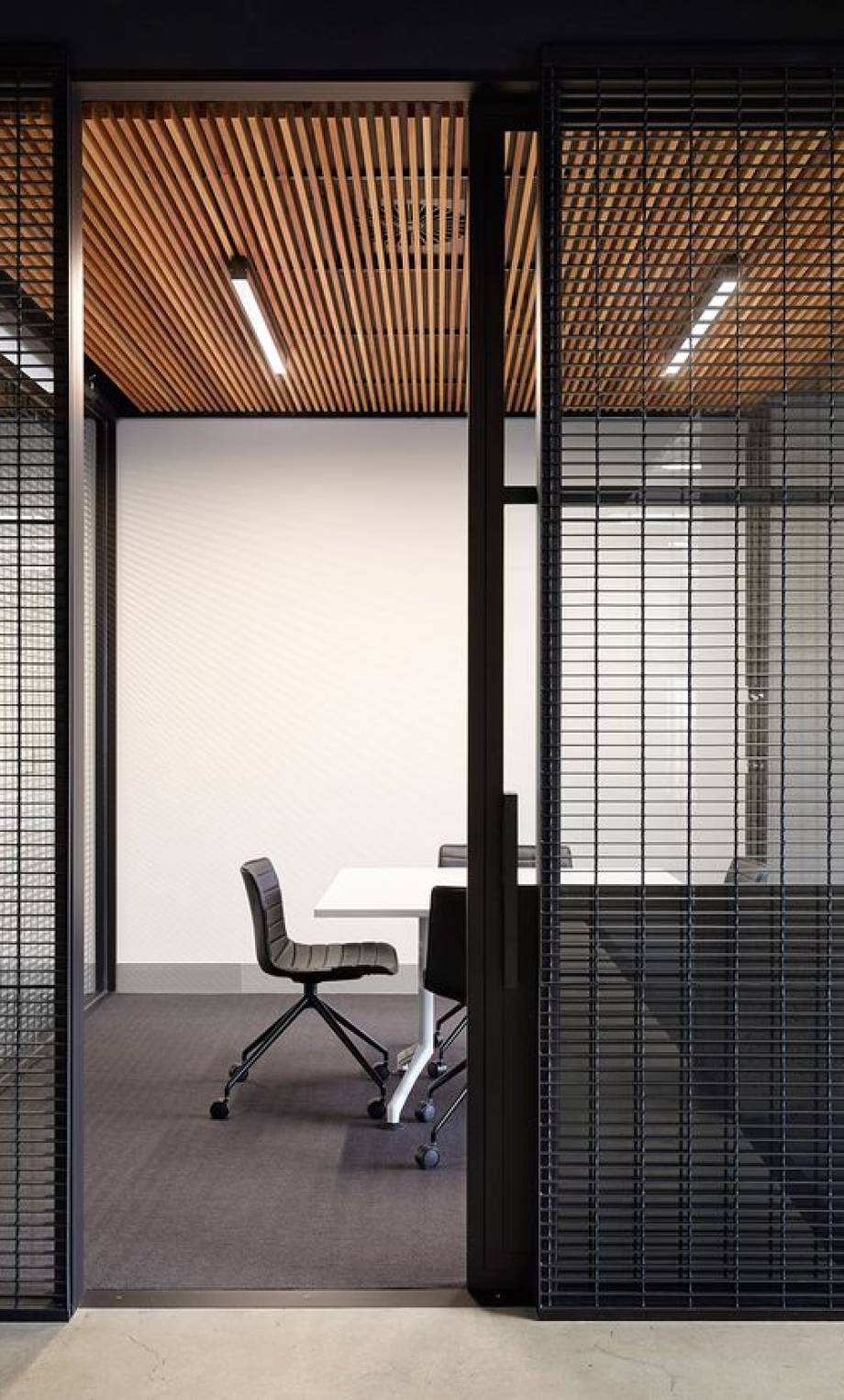 An Office with slats covering the perimeter.